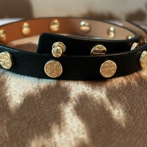 Black and gold leather Tory Burch wrap bracelet.